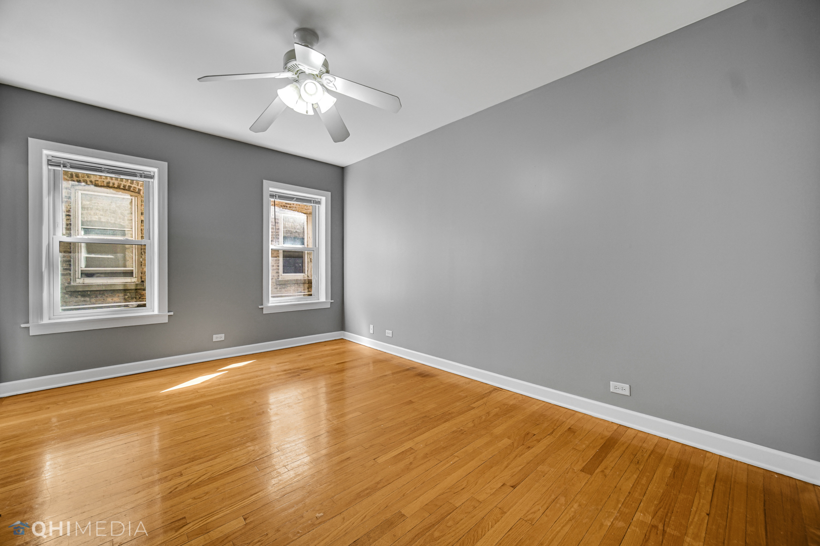 820 Dobson Street, Unit 2E Evanston, IL 60202 - Photo 16 of 19 a view of empty room with wooden floor and fan