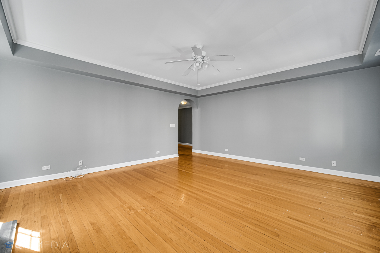 820 Dobson Street, Unit 2E Evanston, IL 60202 - Photo 4 of 19 wooden floor in an empty room with a window