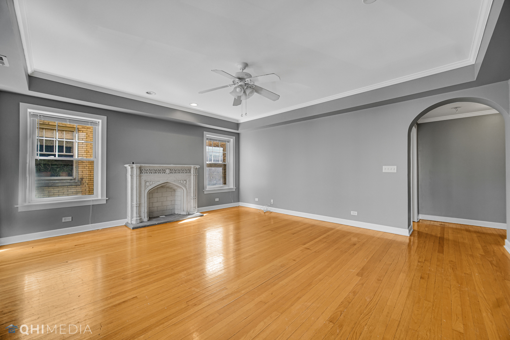 820 Dobson Street, Unit 2E Evanston, IL 60202 - Photo 8 of 19 a view of an empty room with a fireplace and a window