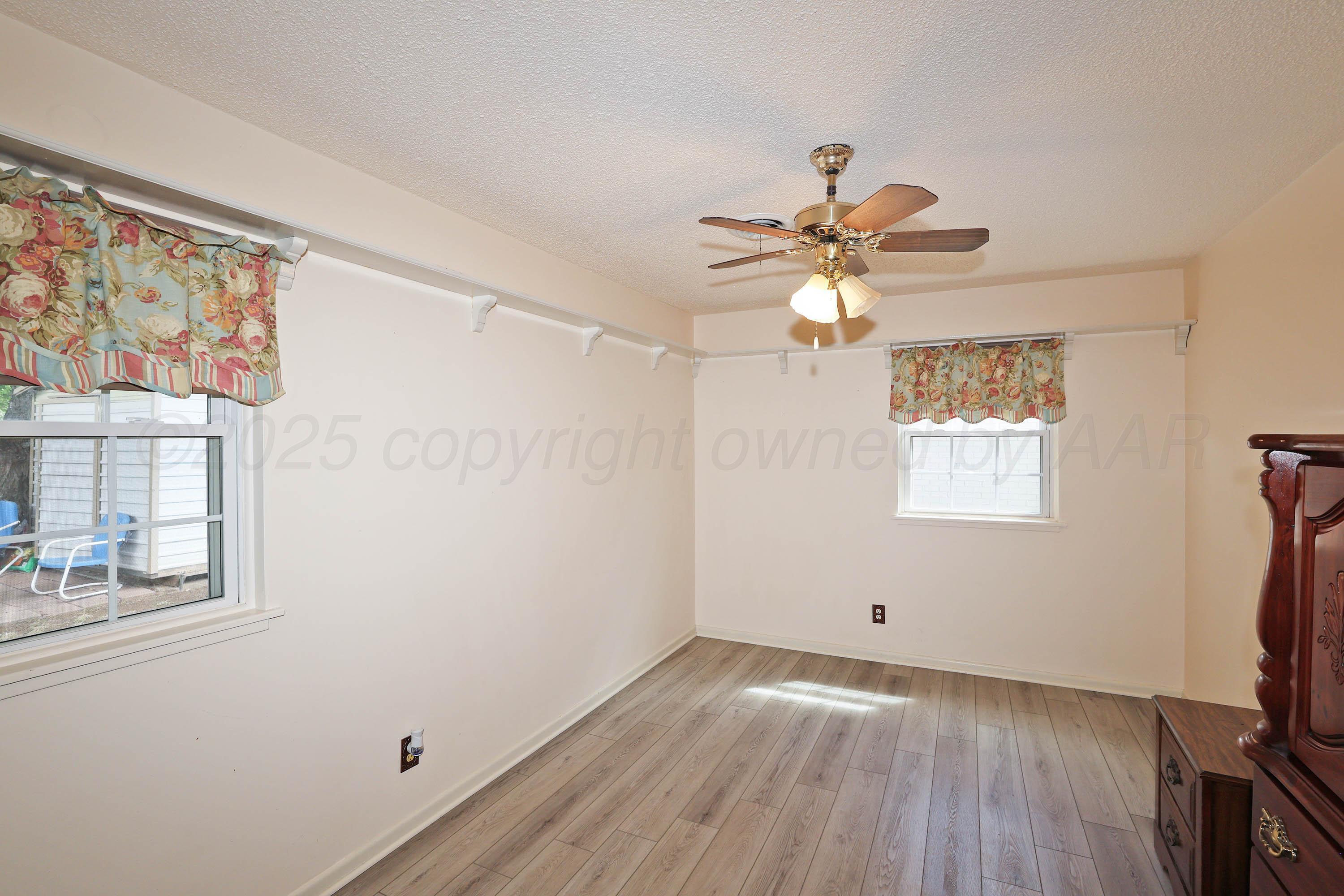 4119 Tucson Drive Amarillo, TX 79109 - Photo 14 of 22 a view of workspace with wooden floor and window