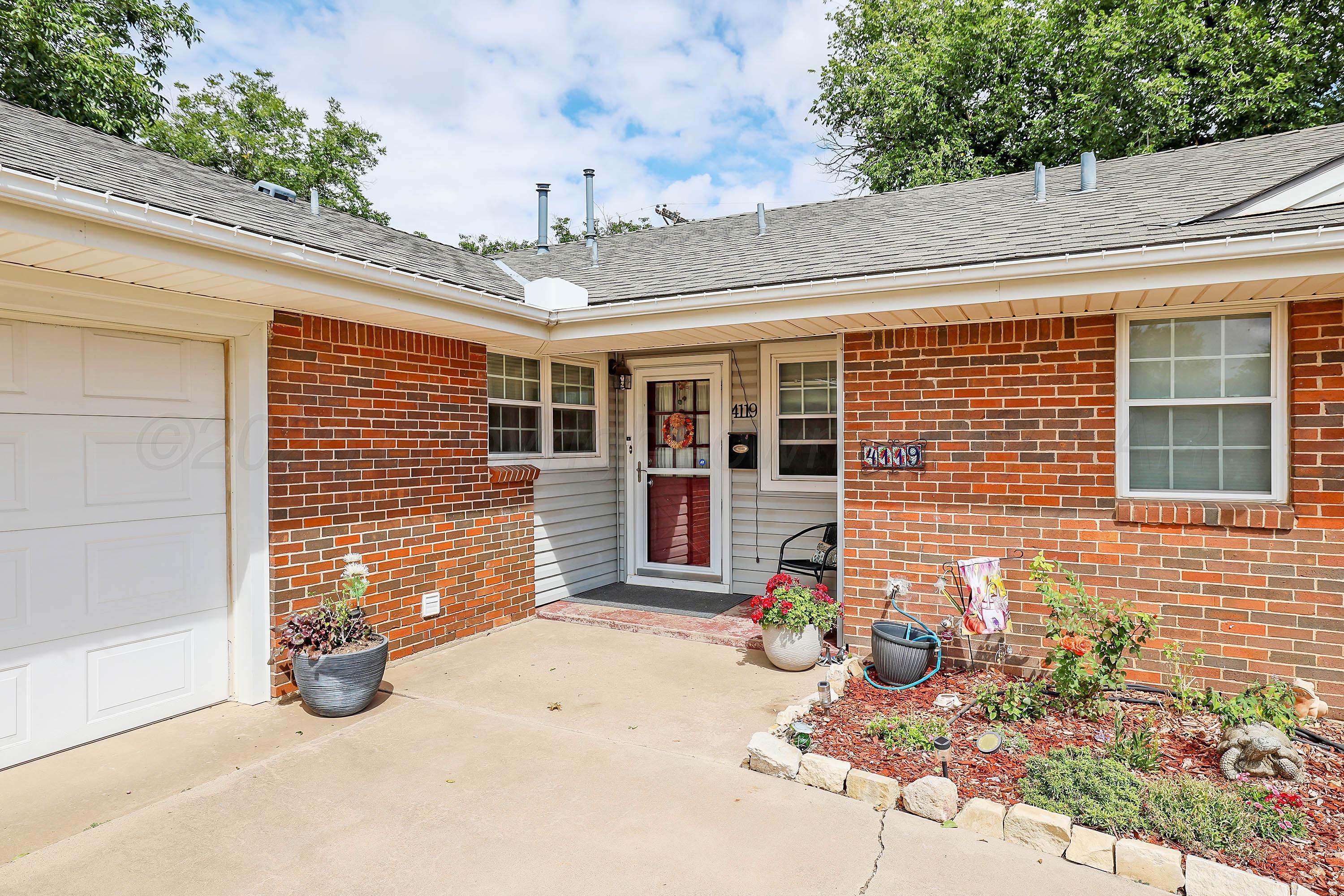4119 Tucson Drive Amarillo, TX 79109 - Photo 2 of 22 a front view of a house with a garage