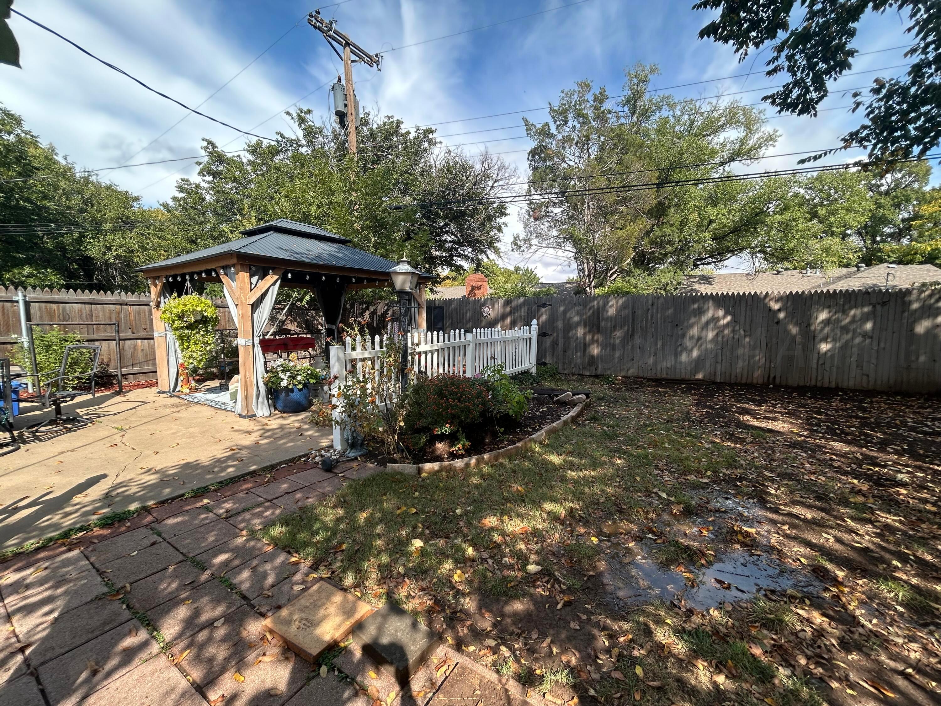 4119 Tucson Drive Amarillo, TX 79109 - Photo 22 of 22 a view of a backyard with a patio