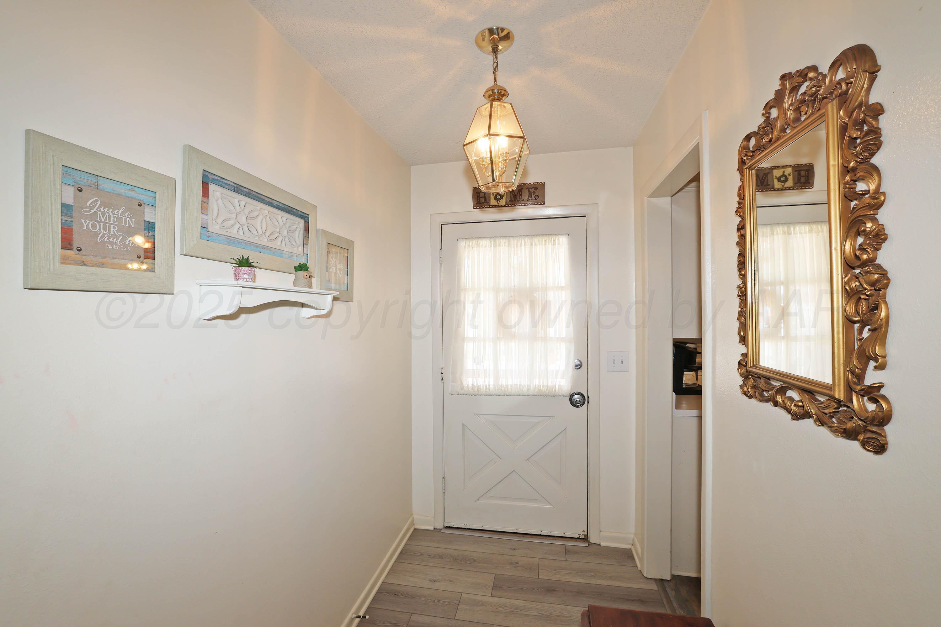 4119 Tucson Drive Amarillo, TX 79109 - Photo 3 of 22 a view of empty room with wooden floor
