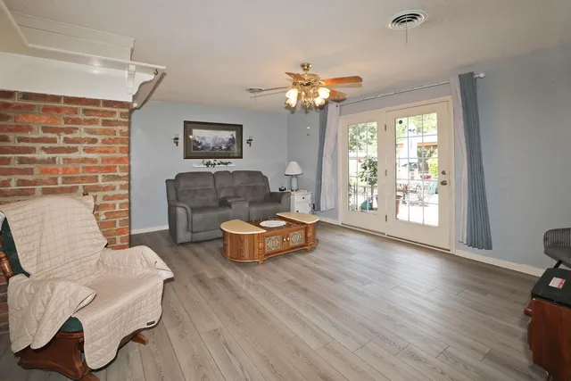 a living room with furniture and a window