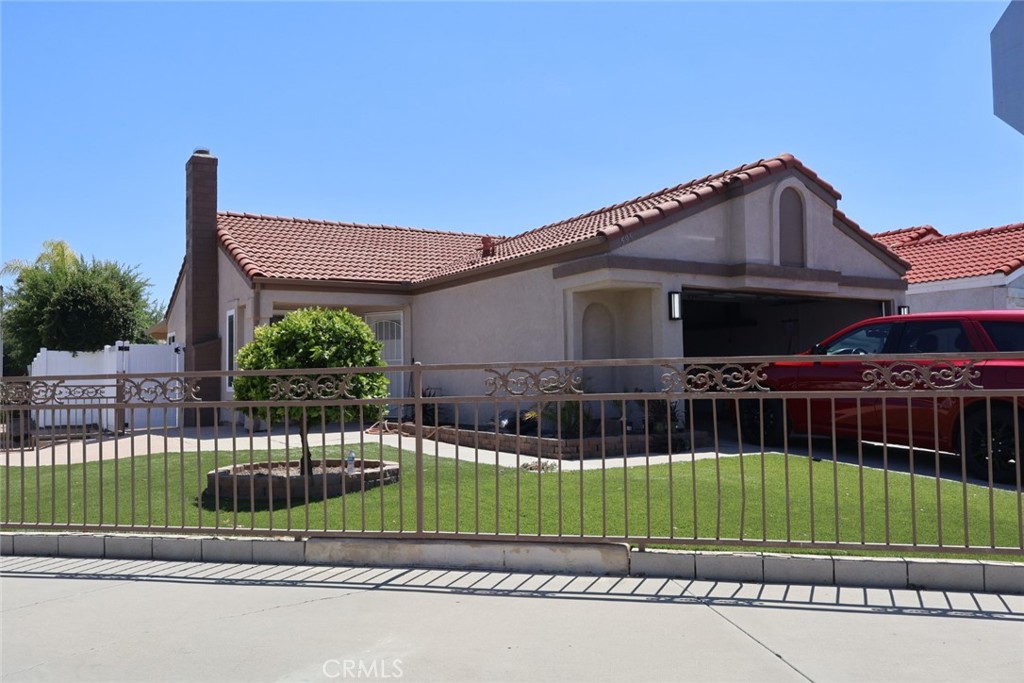 595 Cherry Vista Drive Perris, CA 92571 - Photo 20 of 20 a view of a house with a small yard and plants