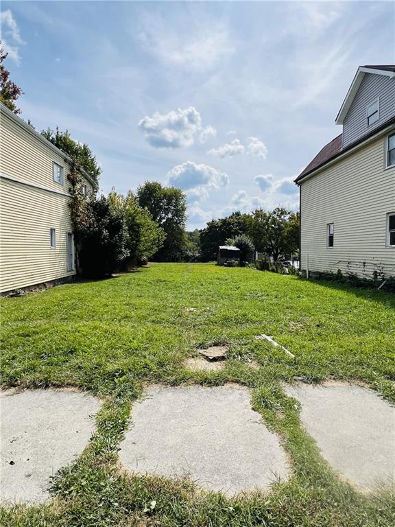 650 Addison Street Washington, PA 15301 - Photo 4 of 4 a view of a backyard with plants and large trees