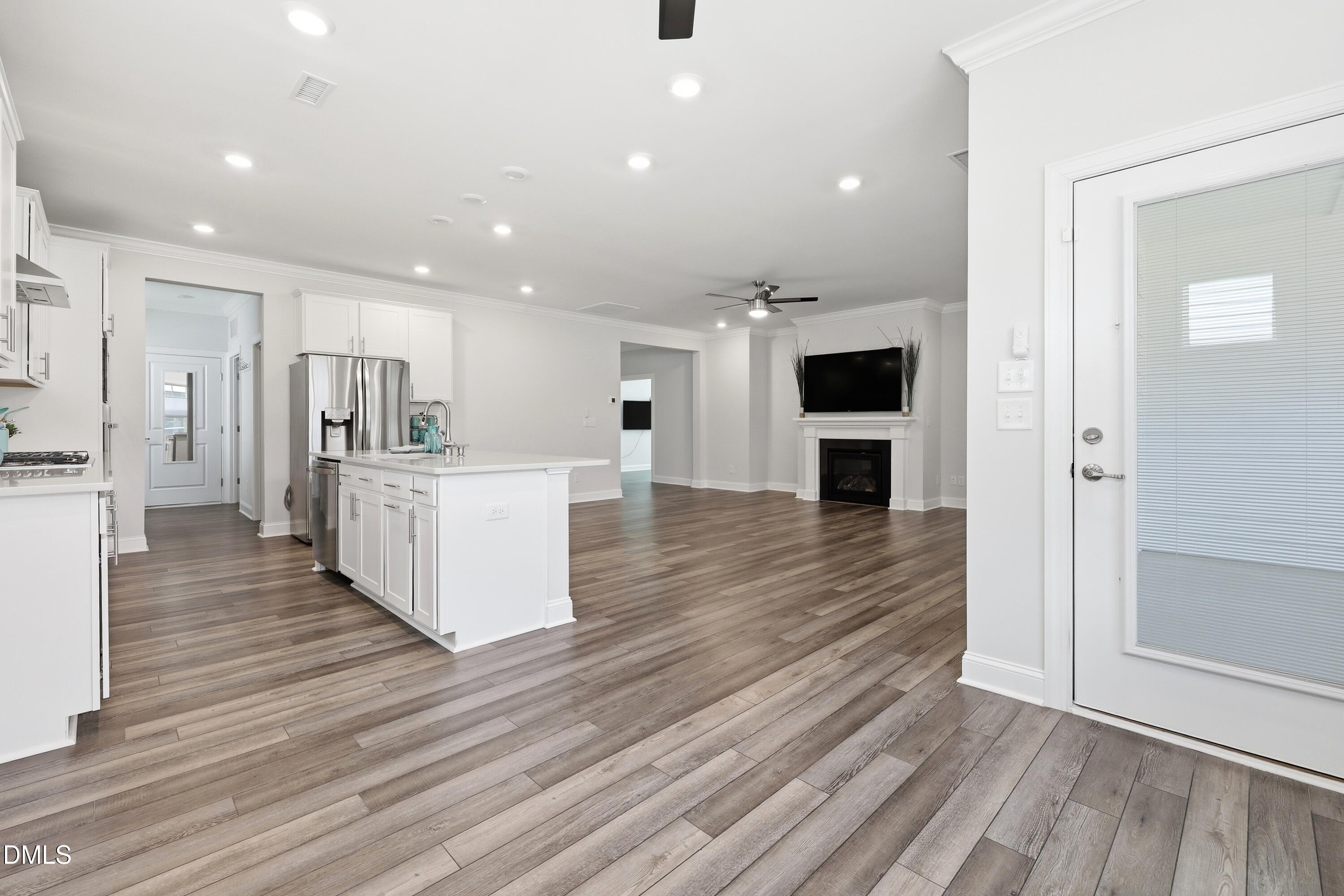 289 English Violet Lane Raleigh, NC 27610 - Photo 38 of 40 a living room with stainless steel appliances kitchen island furniture and wooden floor
