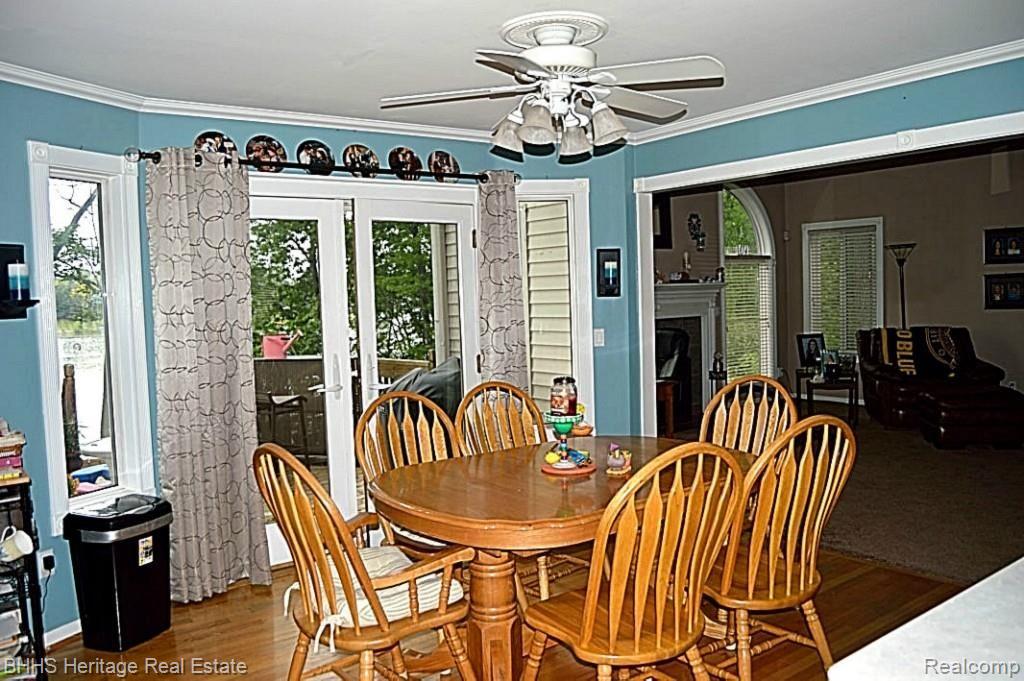 1465 Remsing Street Hartland, MI 48353 - Photo 8 of 27 Eat-in kitchen with hardwood floors and door wall to Expansive Rear Deck