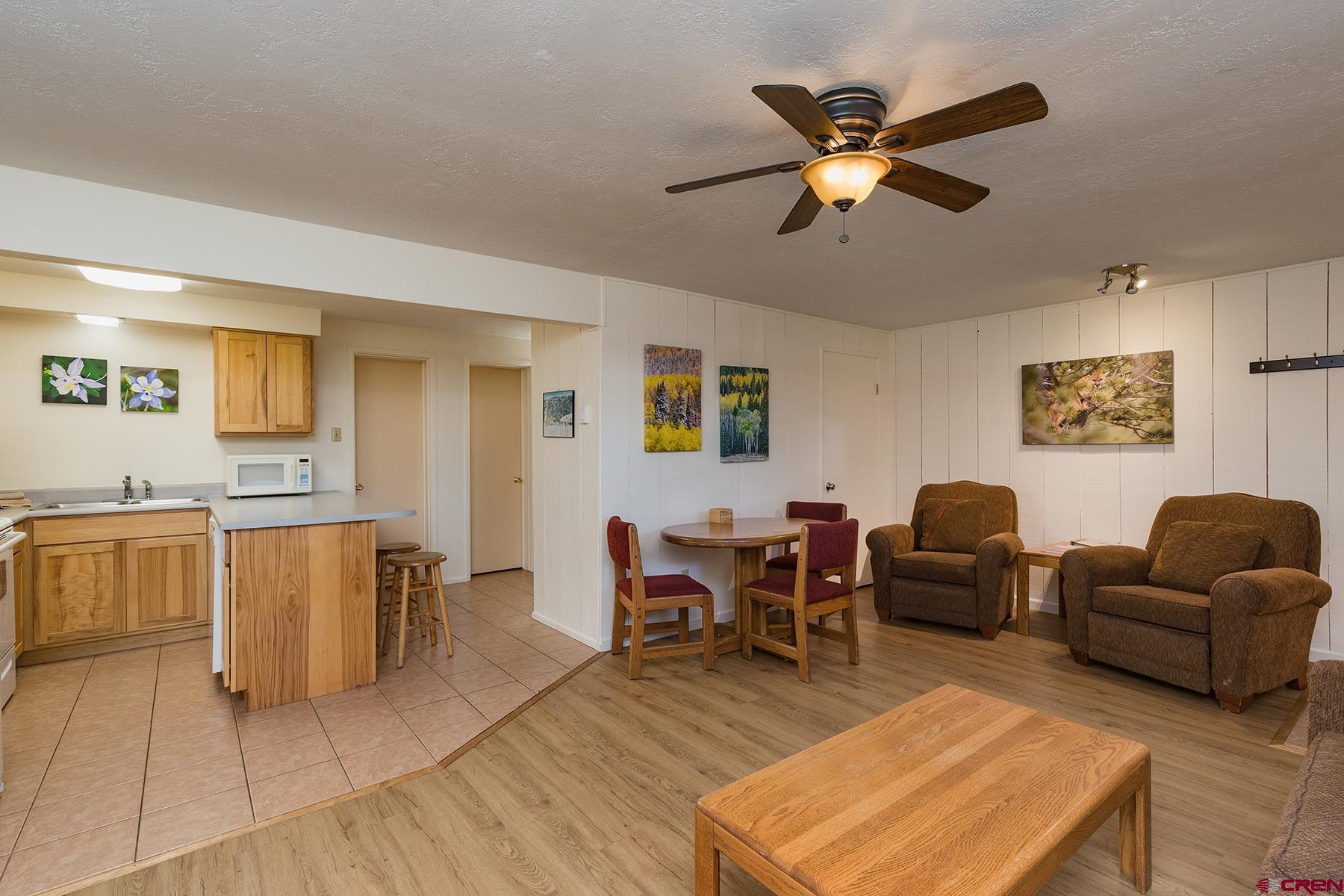400 Sheol Street, Unit 8 Durango, CO 81301 - Photo 16 of 35 a living room with furniture and a wooden floor
