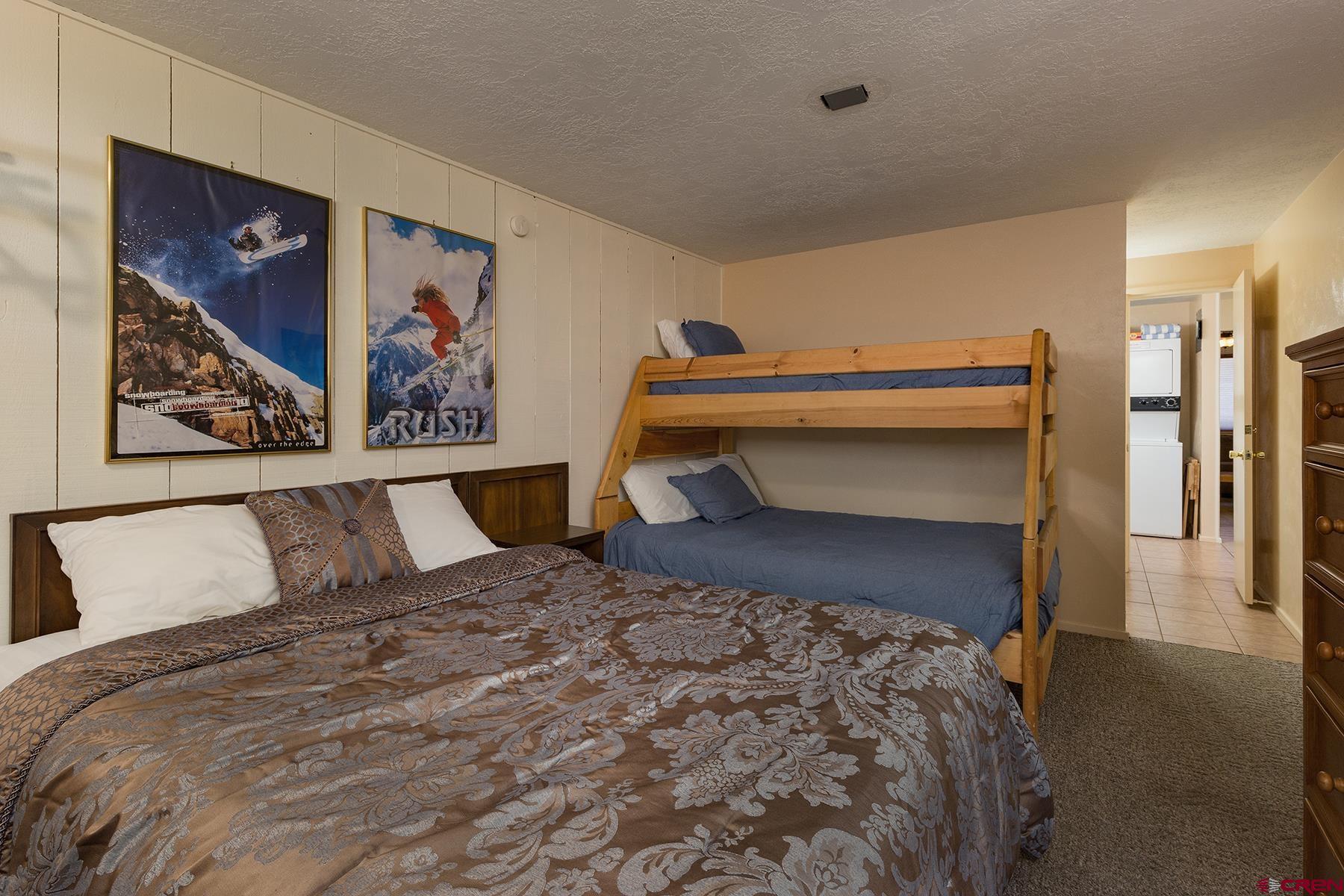 400 Sheol Street, Unit 8 Durango, CO 81301 - Photo 18 of 35 a bedroom with a bed and wall painting