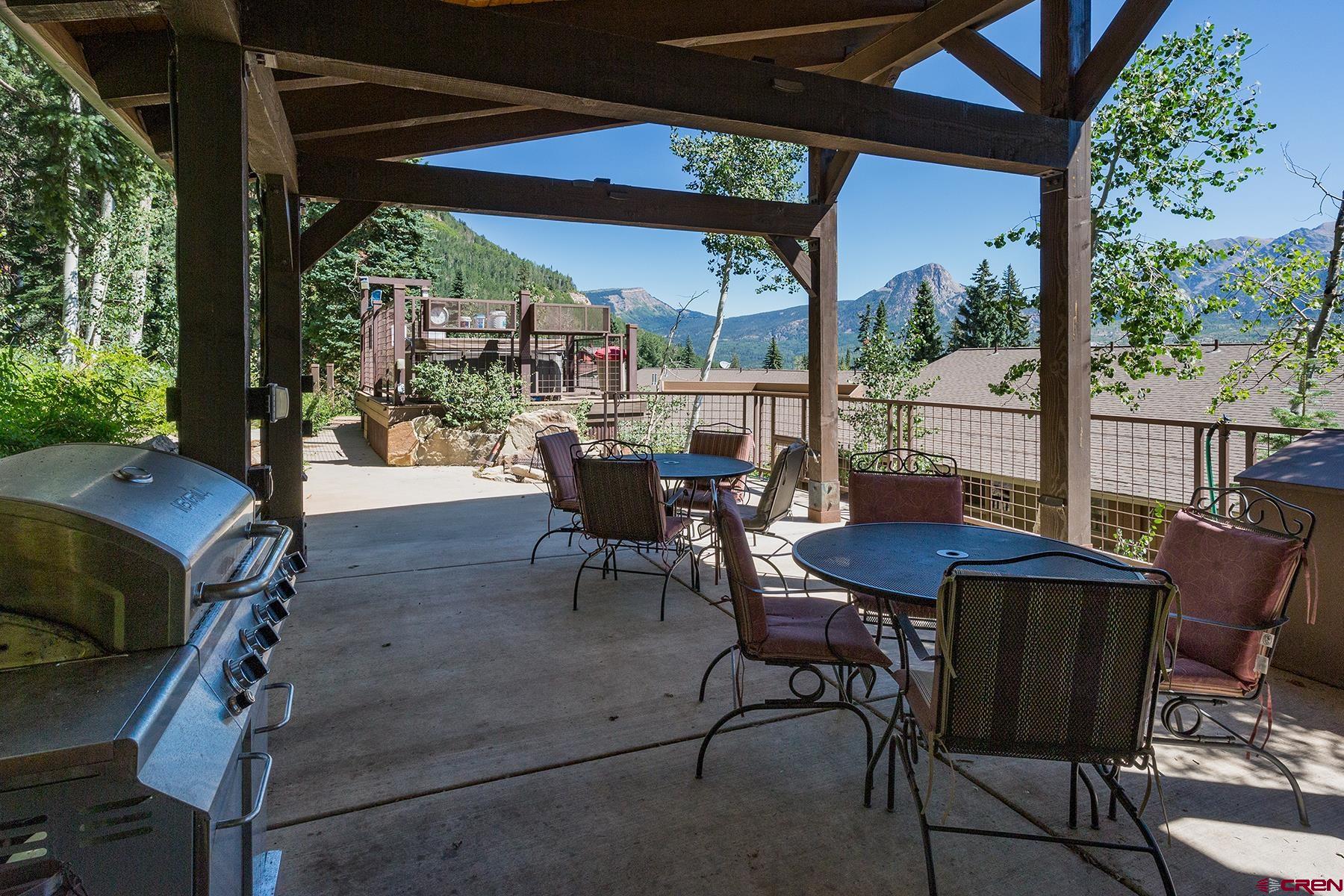 400 Sheol Street, Unit 8 Durango, CO 81301 - Photo 25 of 35 a view of a patio with a dining table and chairs
