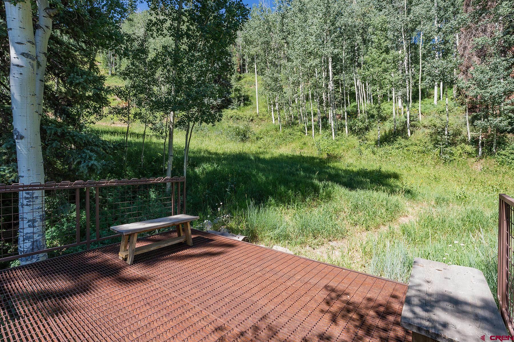 400 Sheol Street, Unit 8 Durango, CO 81301 - Photo 31 of 35 a view of a bench in a garden
