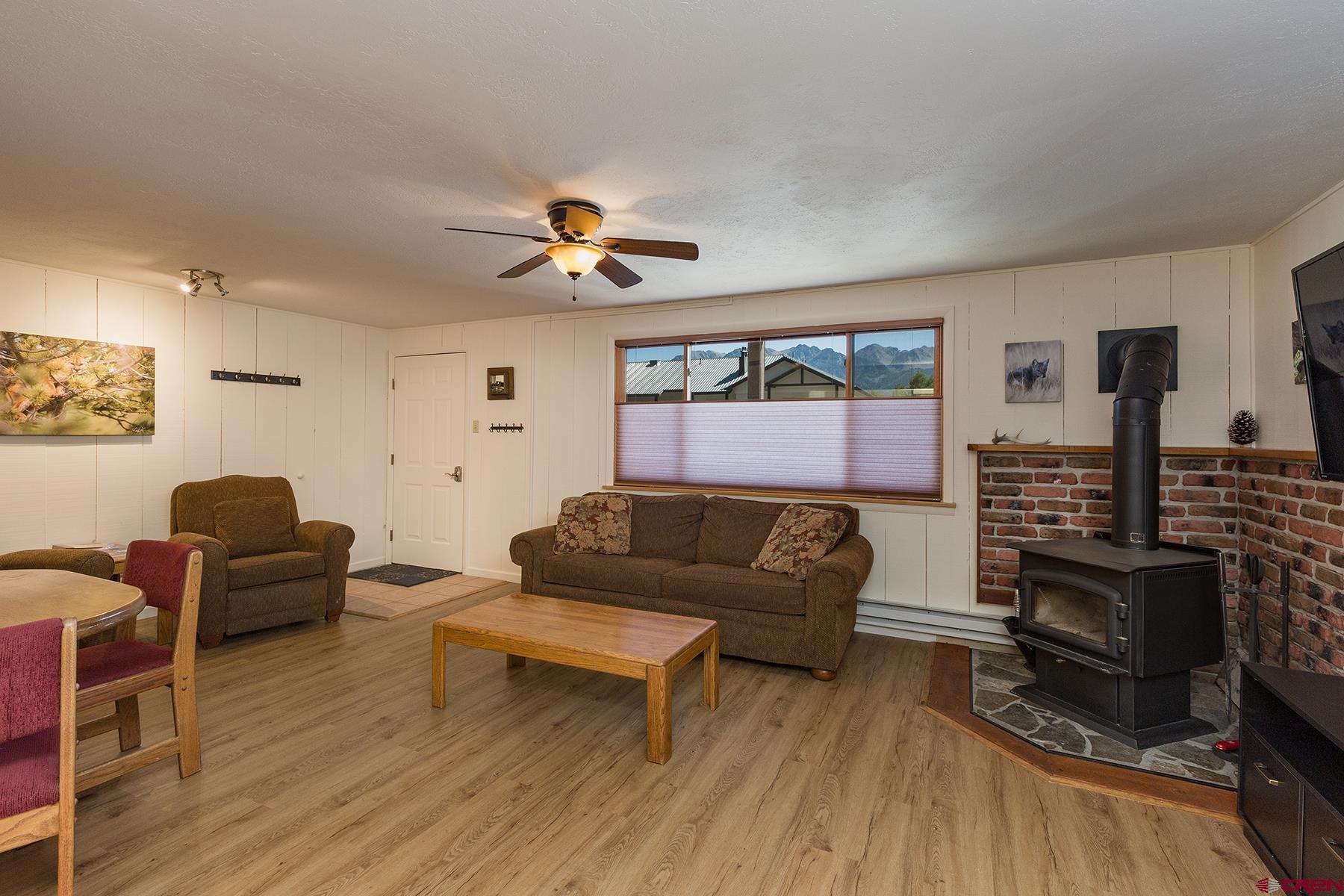 400 Sheol Street, Unit 8 Durango, CO 81301 - Photo 6 of 35 a living room with furniture and a wooden floor