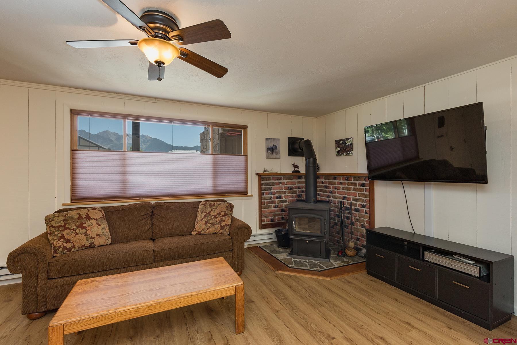 400 Sheol Street, Unit 8 Durango, CO 81301 - Photo 7 of 35 a living room with furniture and a flat screen tv