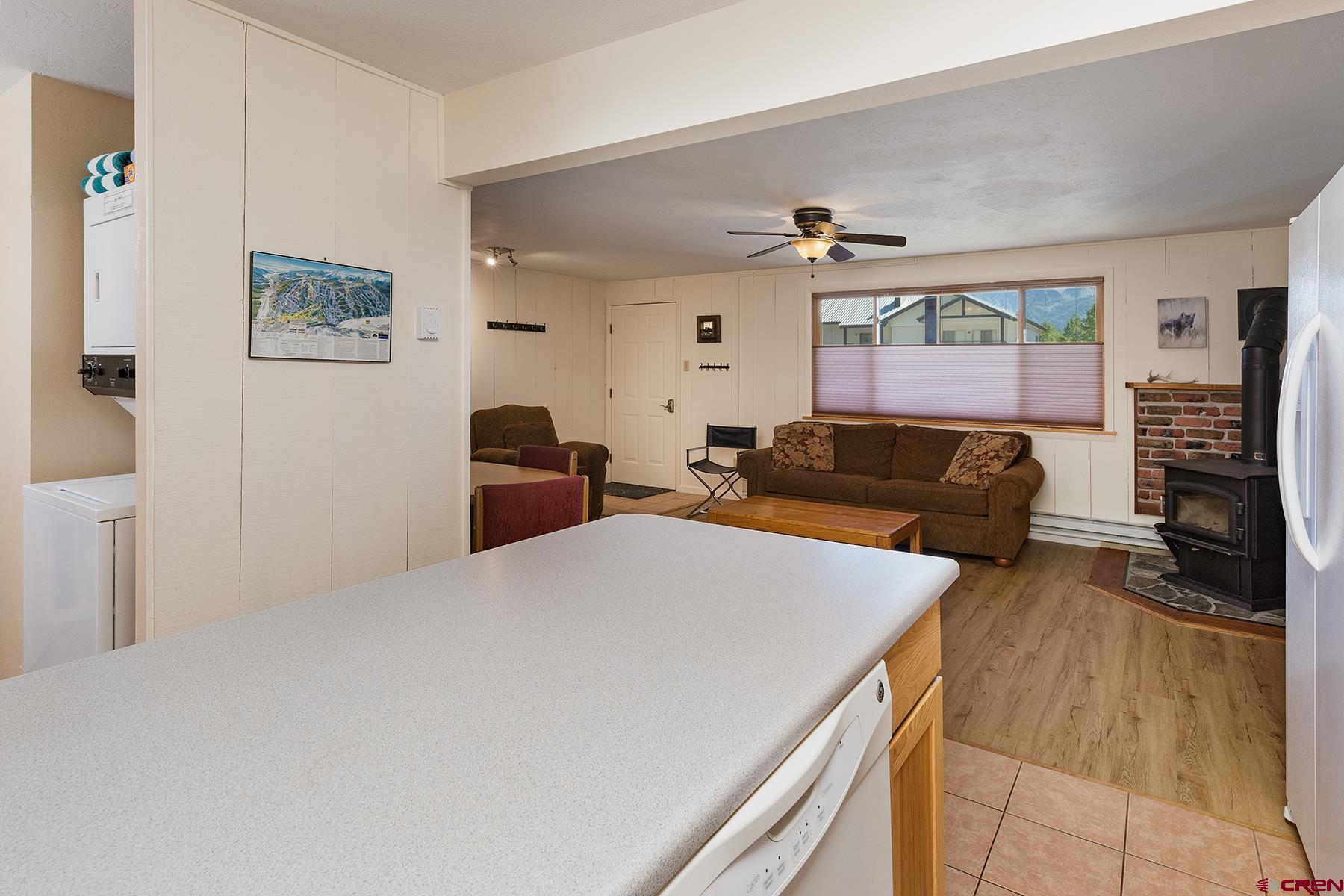 400 Sheol Street, Unit 8 Durango, CO 81301 - Photo 9 of 35 a living room with furniture and a flat screen tv