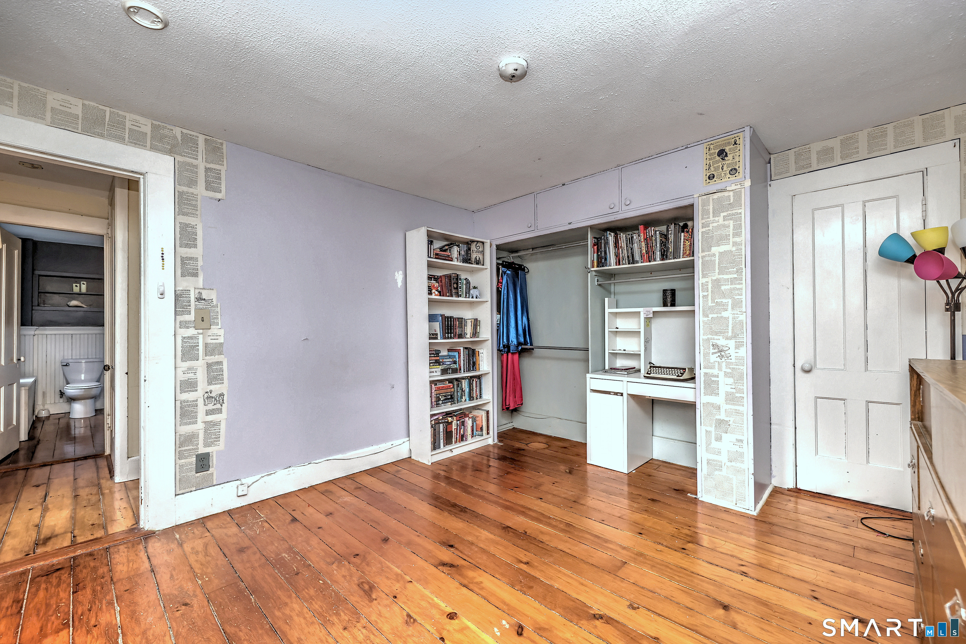 186 Jones Hill Road West Haven, CT 06516 - Photo 29 of 33 a room with a bed and a book shelf