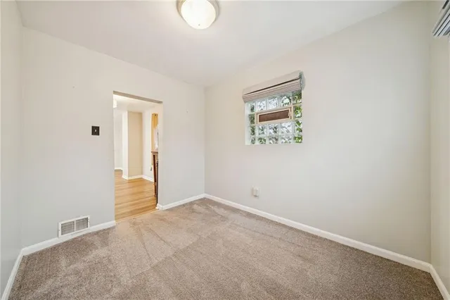 a bathroom with a bathtub toilet and shower