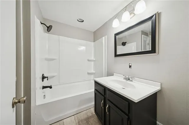 a view of an empty room with a fan