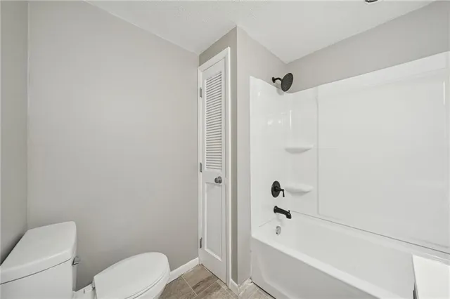 a view of an empty room with a fan