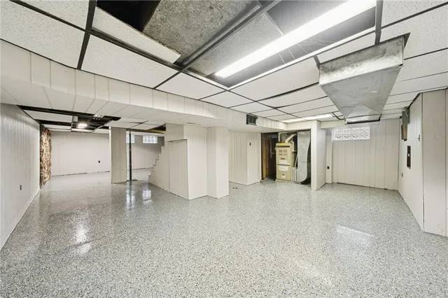 a view of yard covered with snow in front of house