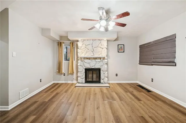 a large kitchen with stainless steel appliances granite countertop a refrigerator and a sink