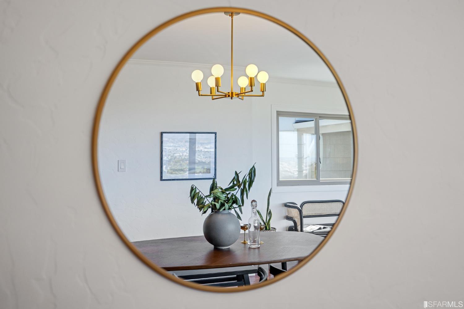 1368 Hillcrest Boulevard Millbrae, CA 94030 - Photo 20 of 65 a view of a dining room with a mirror and wooden floor
