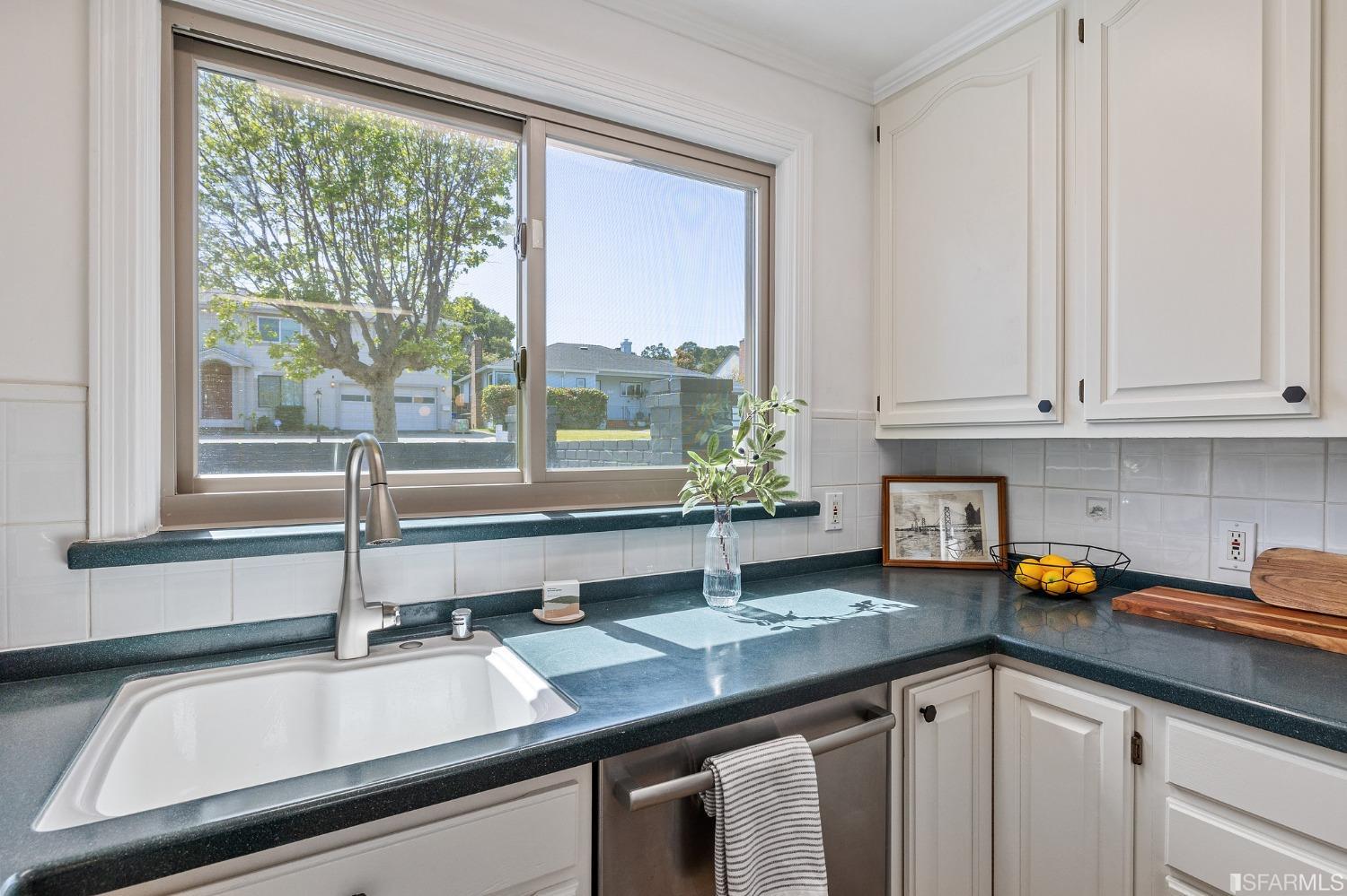 1368 Hillcrest Boulevard Millbrae, CA 94030 - Photo 24 of 65 a kitchen with a sink and a window