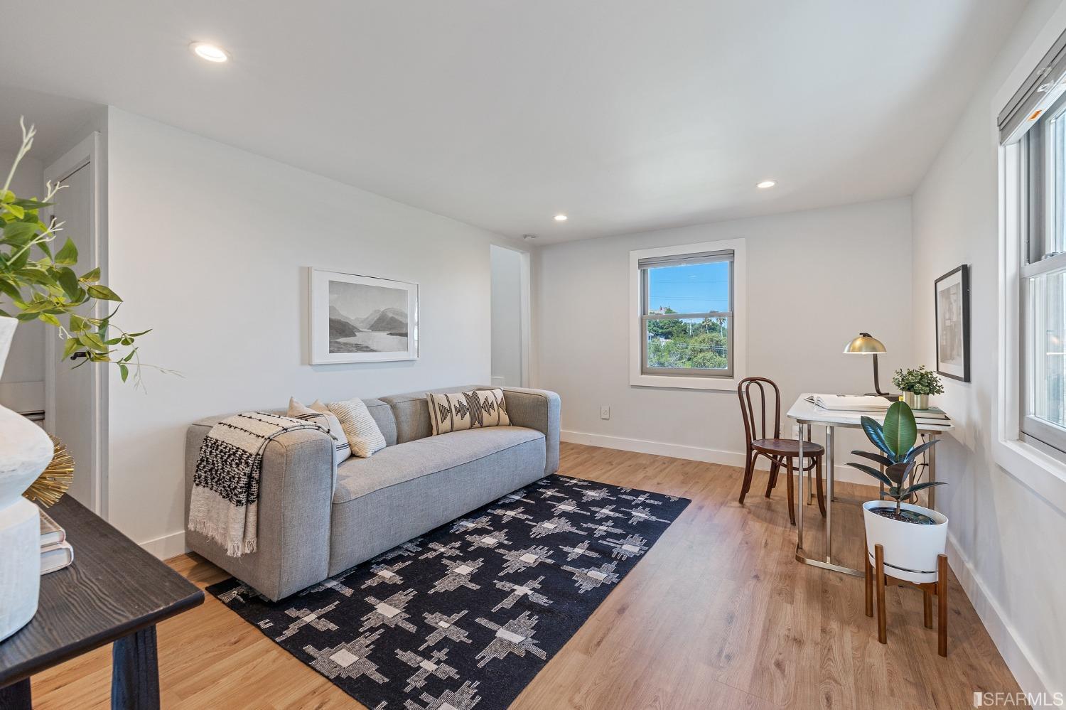 1368 Hillcrest Boulevard Millbrae, CA 94030 - Photo 53 of 65 a living room with furniture and a wooden floor