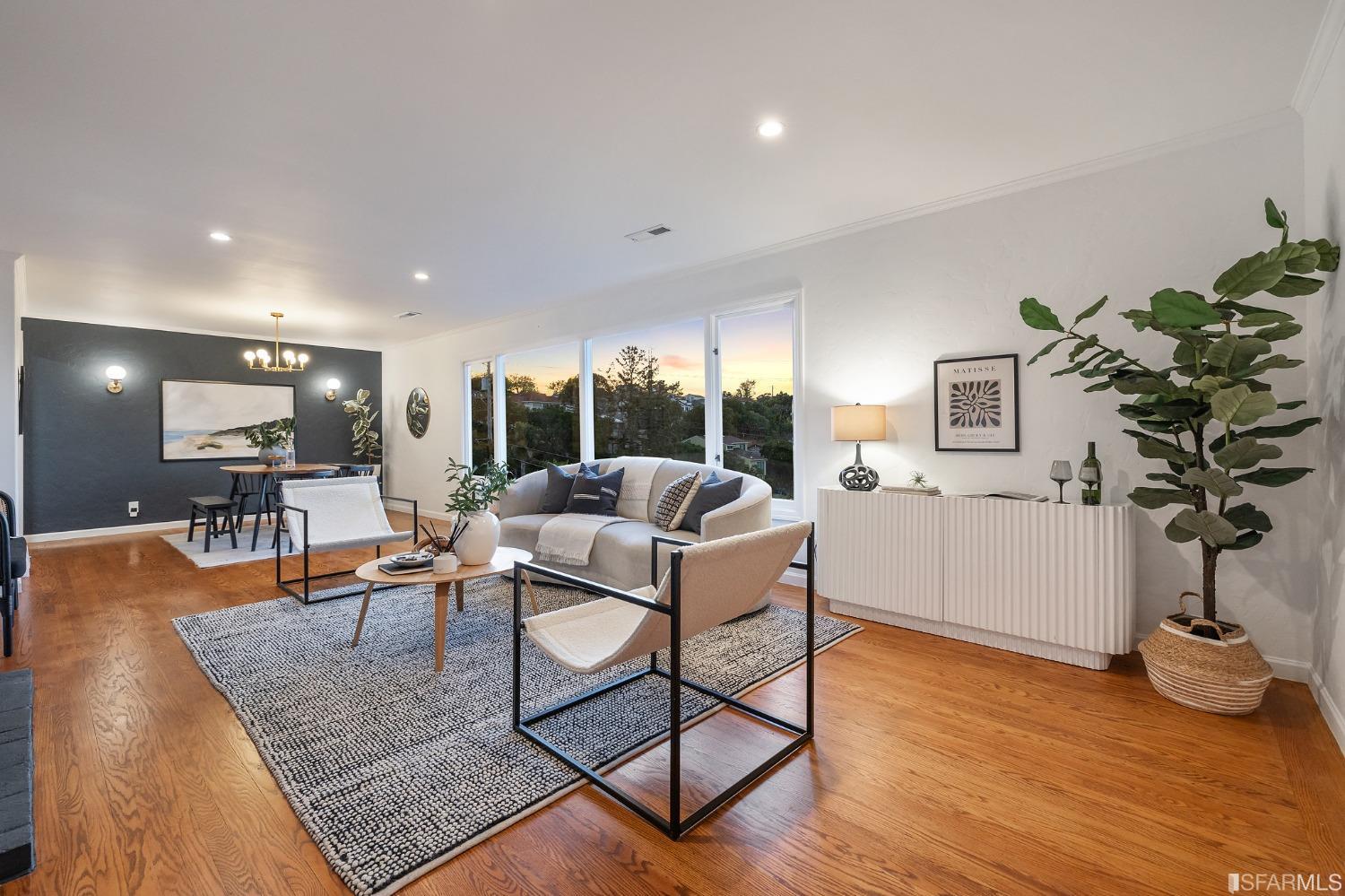 1368 Hillcrest Boulevard Millbrae, CA 94030 - Photo 65 of 65 a living room with furniture a wooden floor and a potted plant