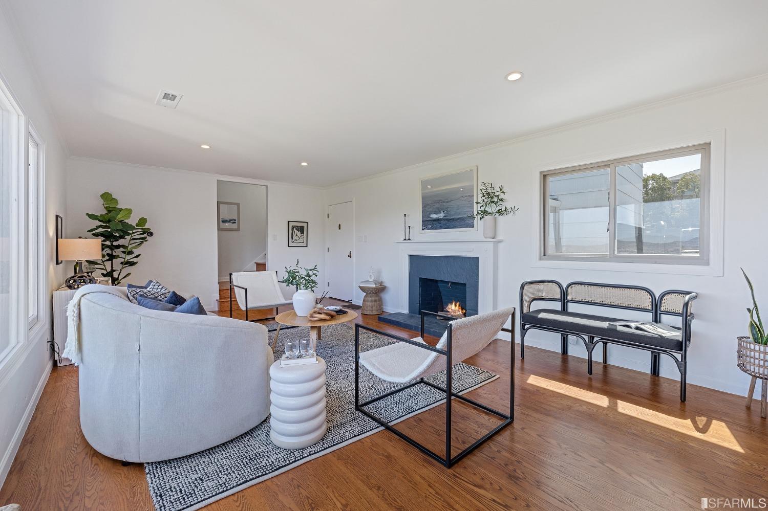 1368 Hillcrest Boulevard Millbrae, CA 94030 - Photo 10 of 65 a living room with furniture and a fireplace