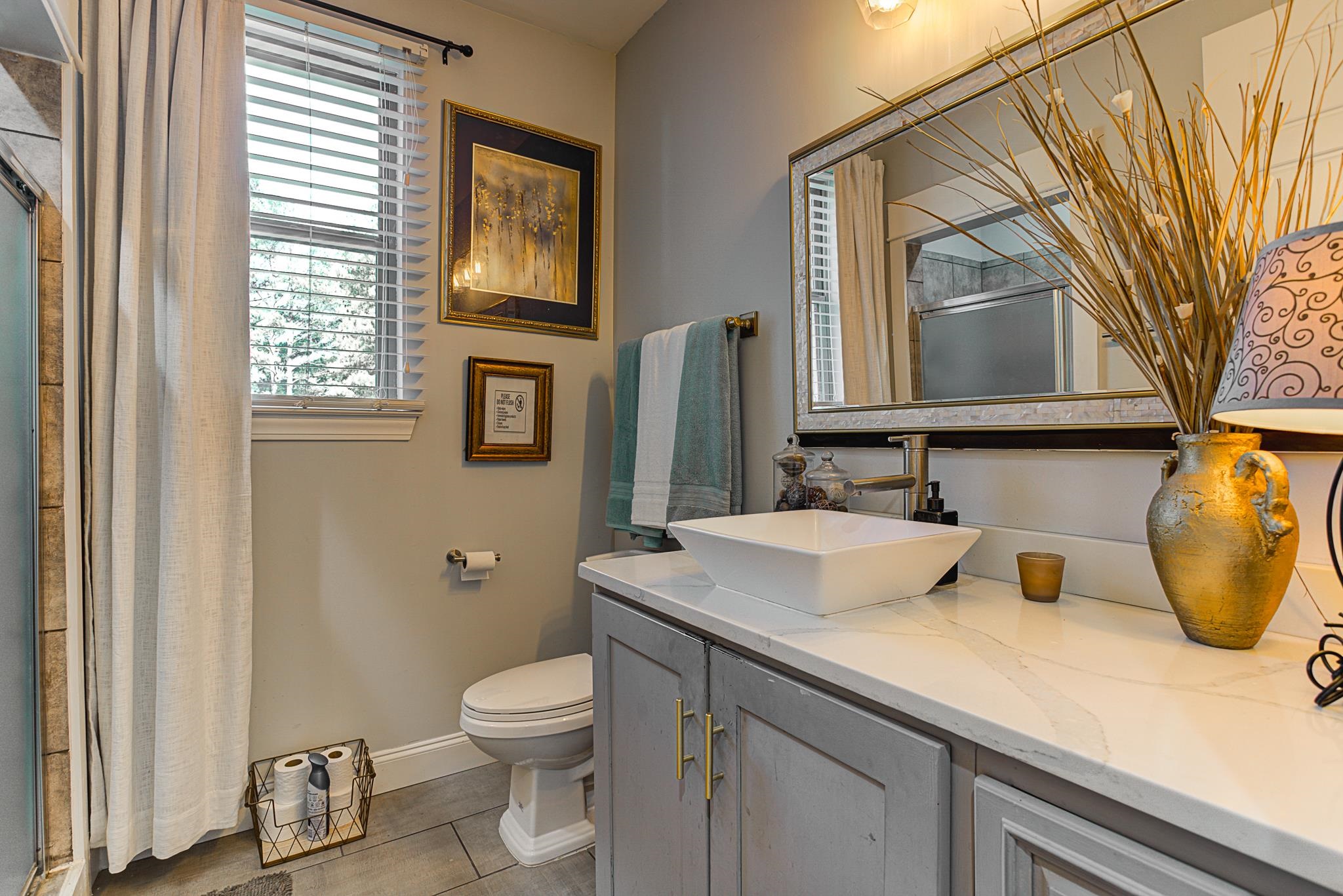 370 Wright Road Piperton, TN 38017 - Photo 17 of 31 Bathroom with vanity, tile patterned flooring, toilet, and walk in shower
