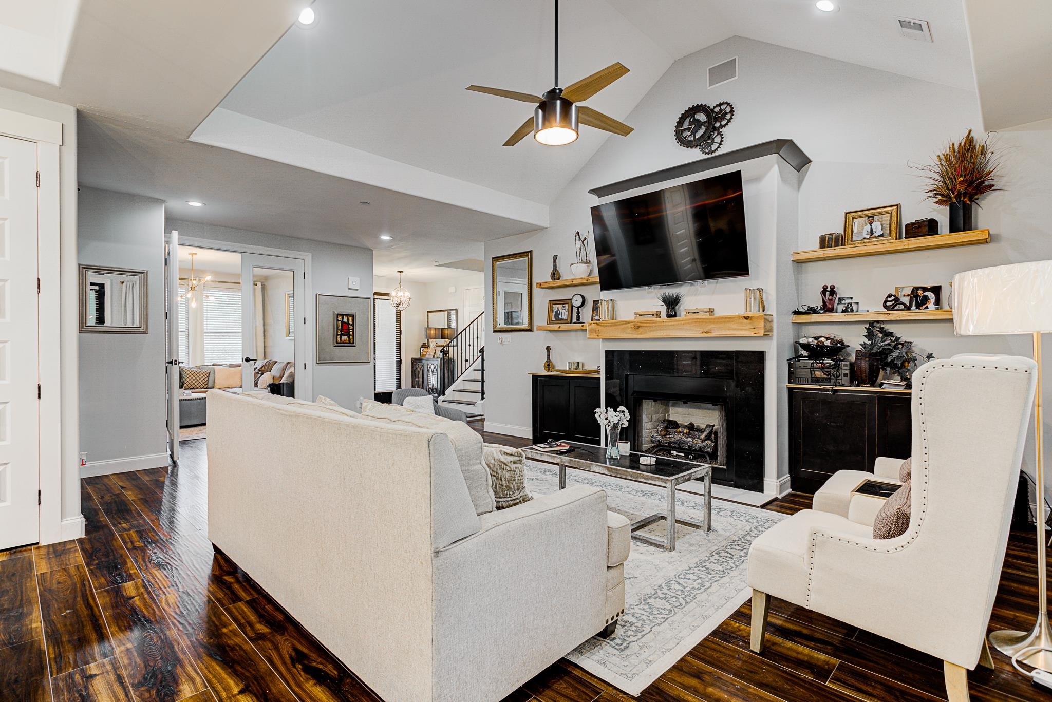 370 Wright Road Piperton, TN 38017 - Photo 6 of 31 Featuring hardwood / wood-style floors, high vaulted ceiling, a fireplace, and ceiling fan.