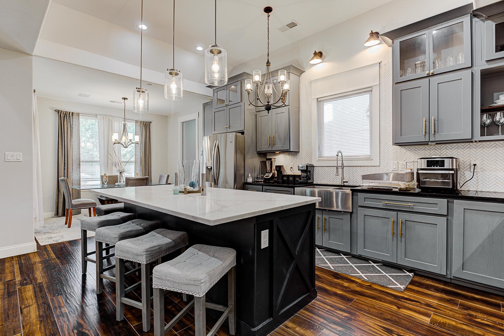 370 Wright Road Piperton, TN 38017 - Photo 8 of 31 Kitchen with gray cabinetry, dark wood-type flooring, and pendant lighting