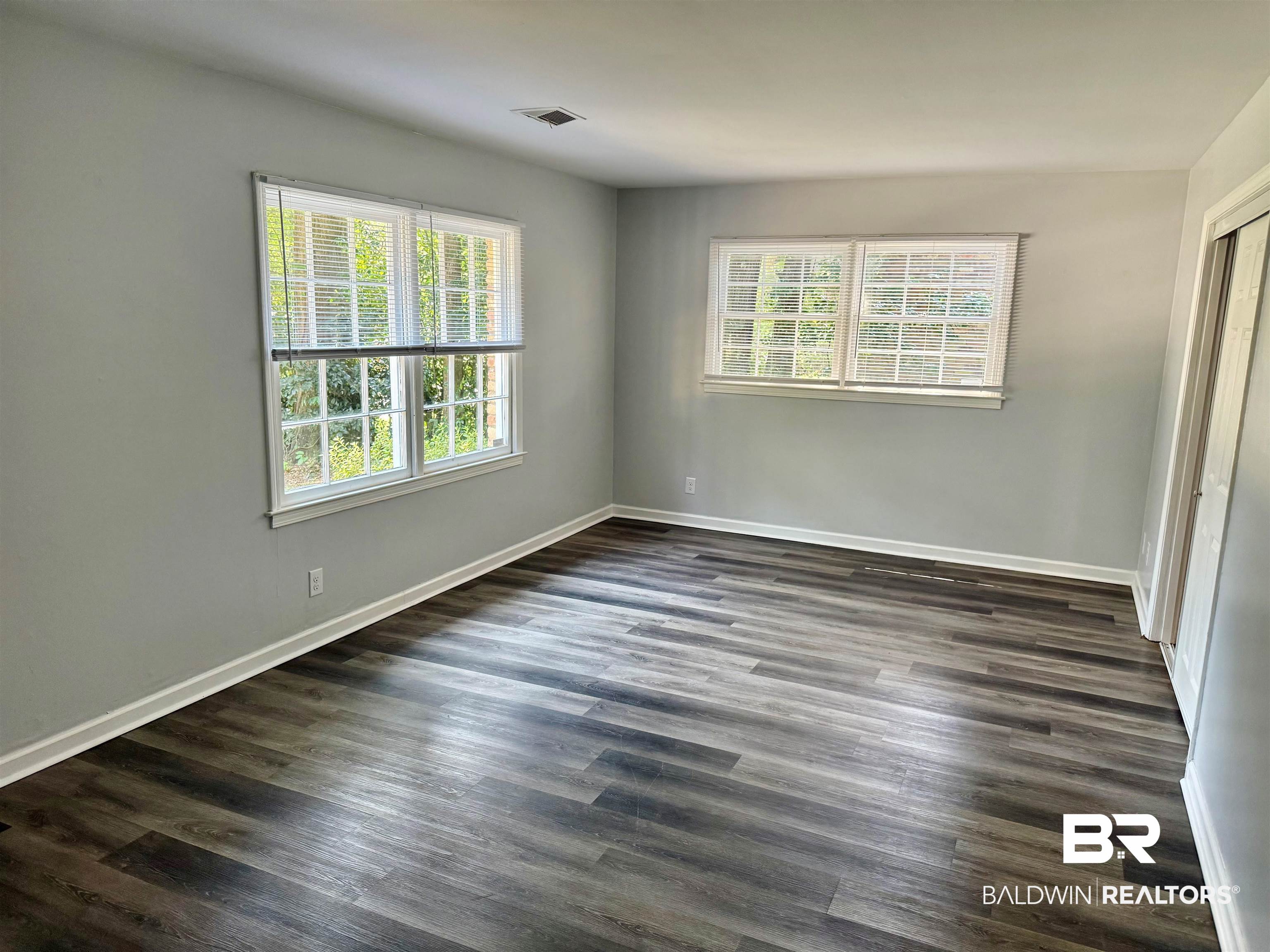 317 Syracuse Street Mobile, AL 36608 - Photo 4 of 27 LVP Flooring throughout downstairs