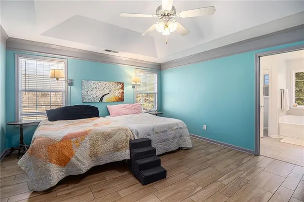 a bedroom with double bed and a window