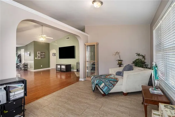 a living room with furniture and a flat screen tv