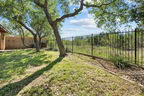 a view of a yard with a tree