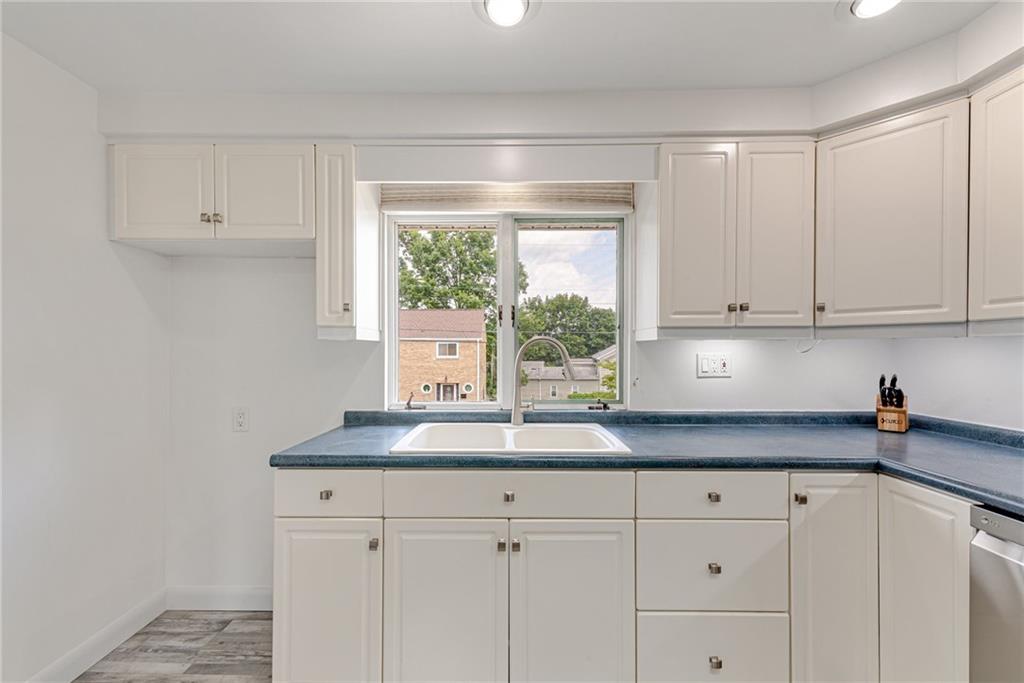 9746 McClellan Street North Huntingdon, PA 15642 - Photo 14 of 30 a kitchen with white cabinets and a window