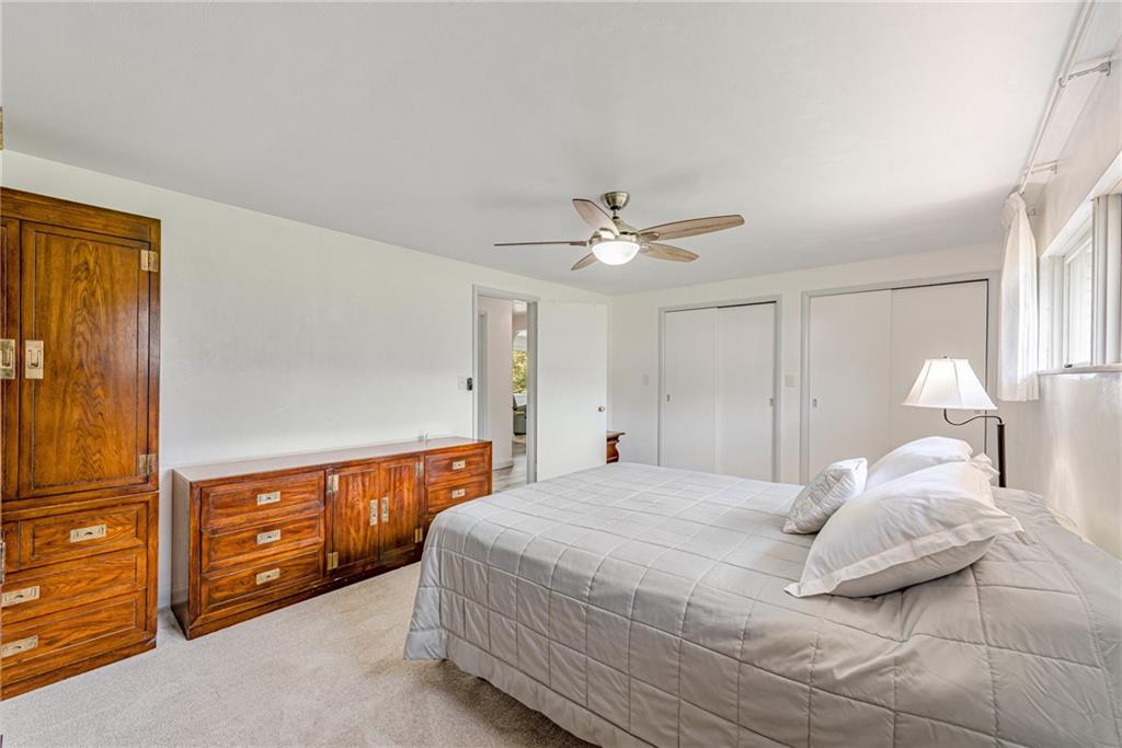 9746 McClellan Street North Huntingdon, PA 15642 - Photo 16 of 30 a bedroom with a bed and a chandelier