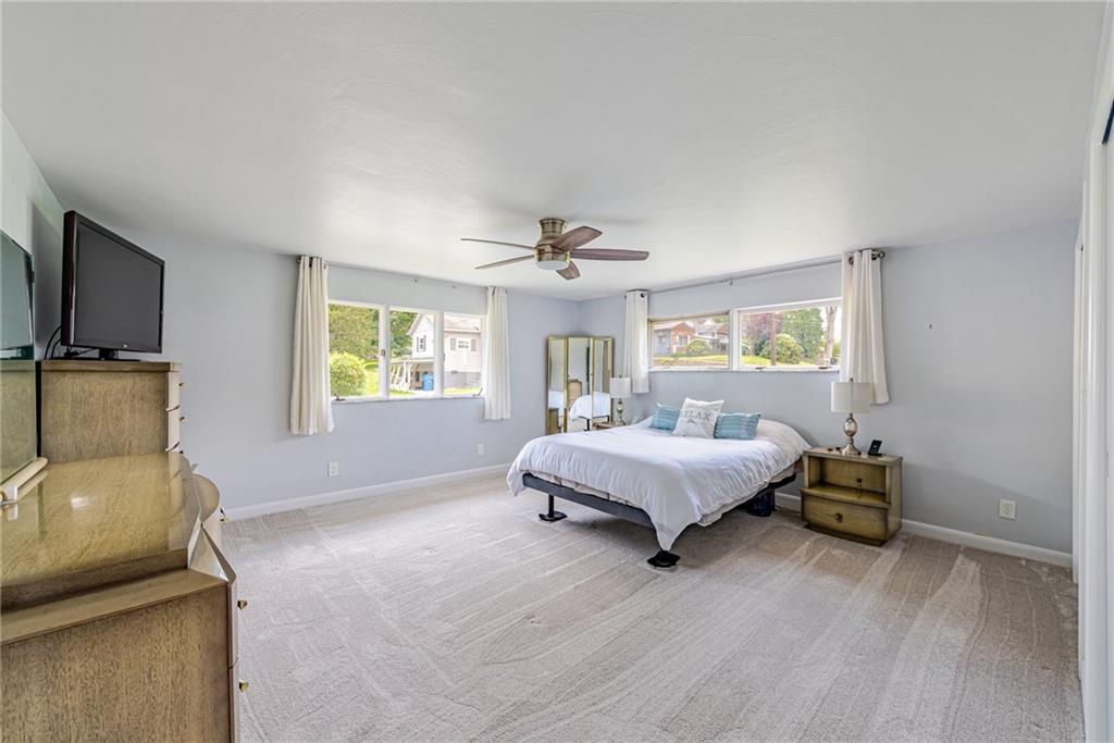 9746 McClellan Street North Huntingdon, PA 15642 - Photo 18 of 30 a spacious bedroom with a bed and a couch