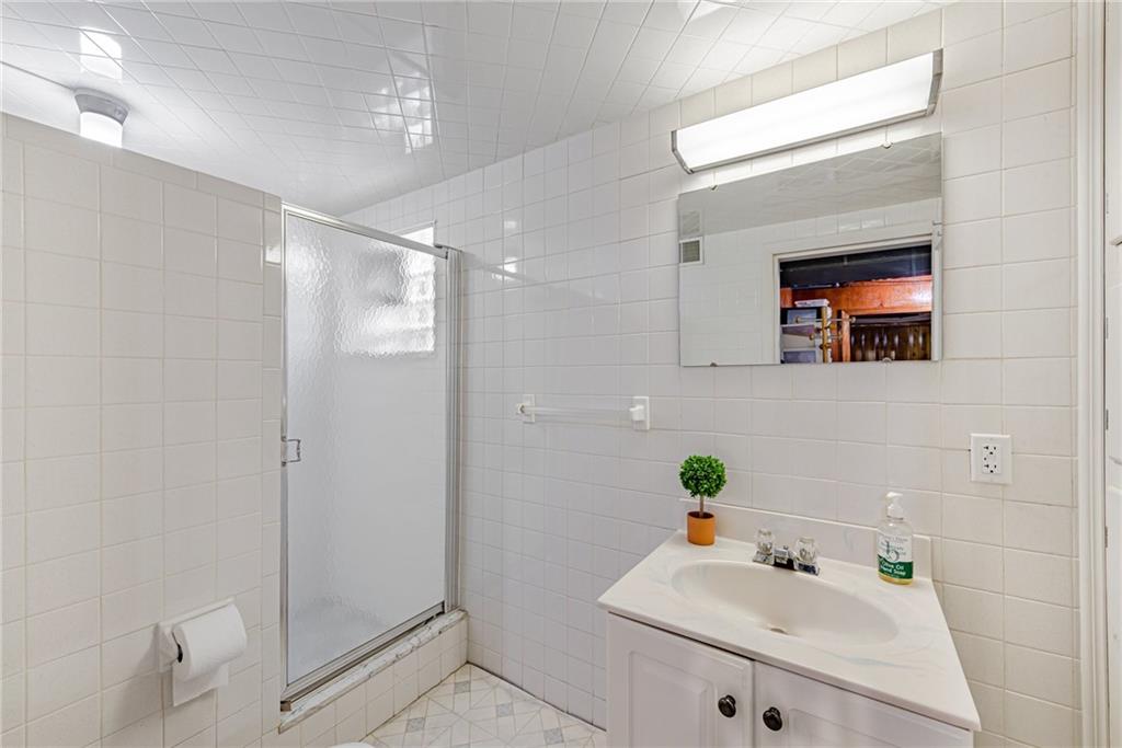 9746 McClellan Street North Huntingdon, PA 15642 - Photo 23 of 30 a bathroom with a sink and a mirror