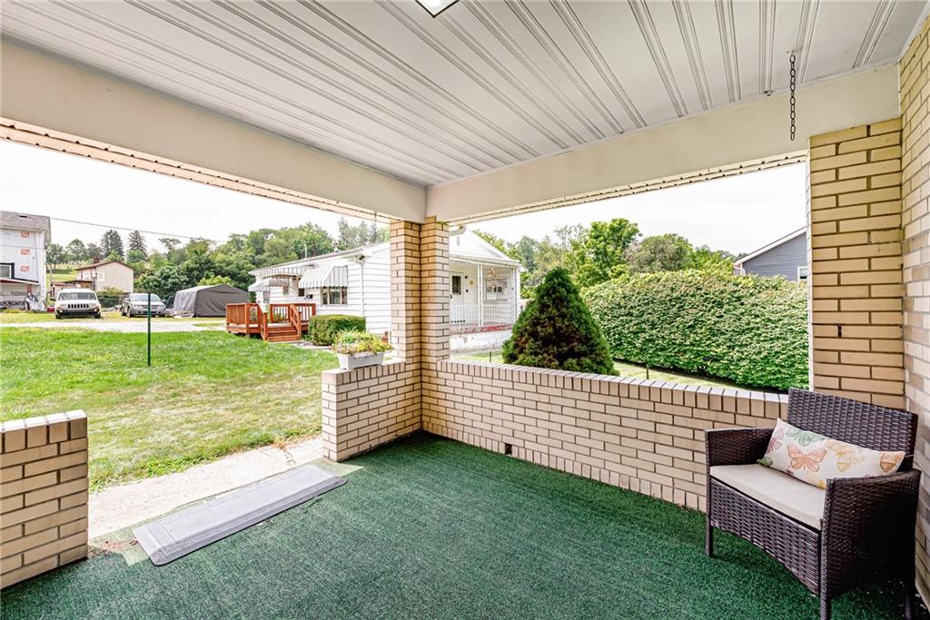 9746 McClellan Street North Huntingdon, PA 15642 - Photo 26 of 30 a view of a porch with furniture and garden