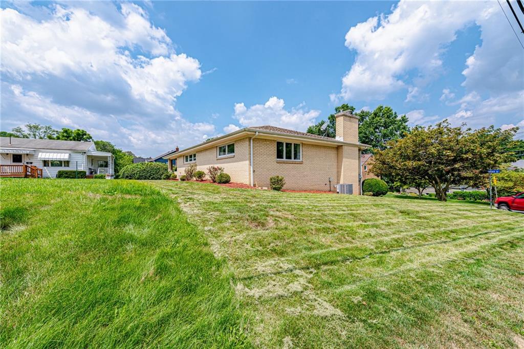 9746 McClellan Street North Huntingdon, PA 15642 - Photo 27 of 30 a front view of house with yard and trees