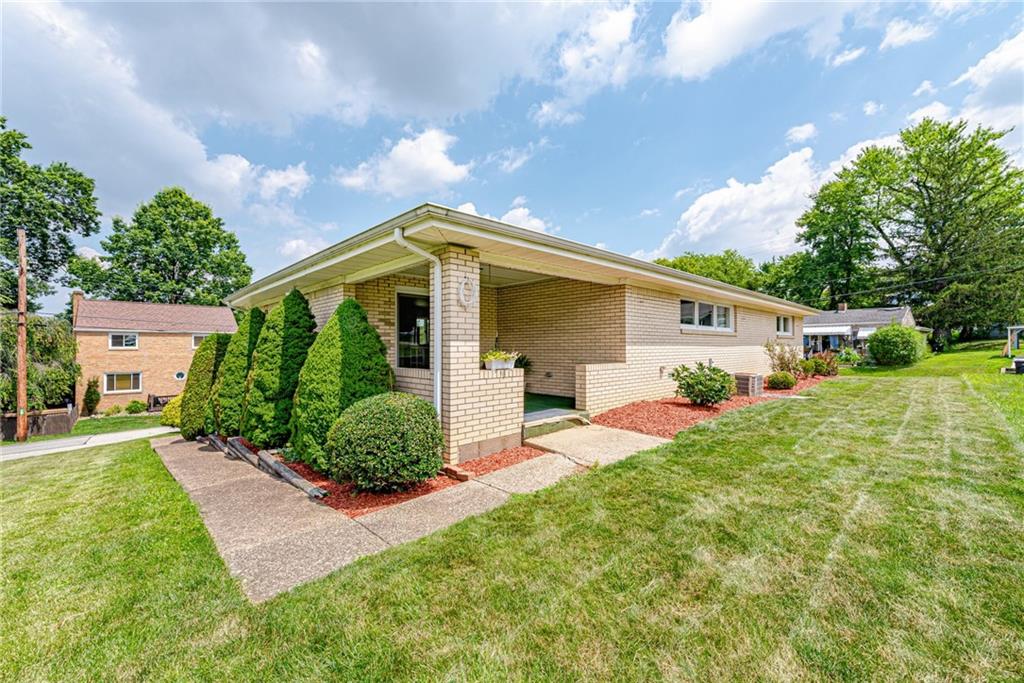 9746 McClellan Street North Huntingdon, PA 15642 - Photo 4 of 30 a front view of house with yard and green space