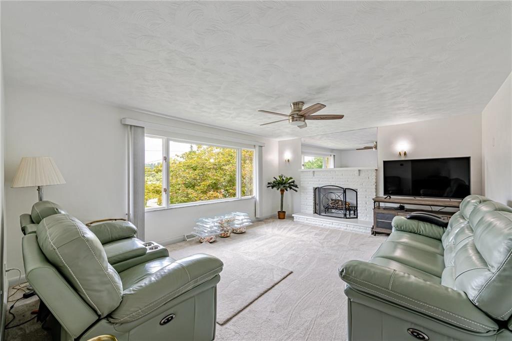 9746 McClellan Street North Huntingdon, PA 15642 - Photo 5 of 30 a living room with furniture and a flat screen tv
