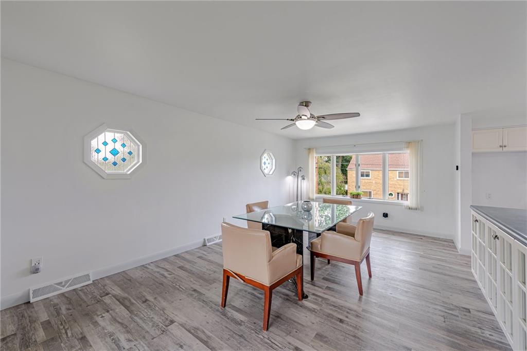 9746 McClellan Street North Huntingdon, PA 15642 - Photo 8 of 30 a view of a dining room with furniture and wooden floor