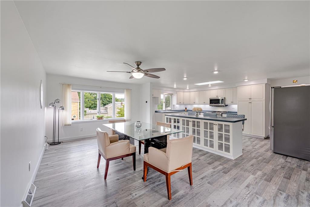 9746 McClellan Street North Huntingdon, PA 15642 - Photo 9 of 30 a dining room with furniture and wooden floor