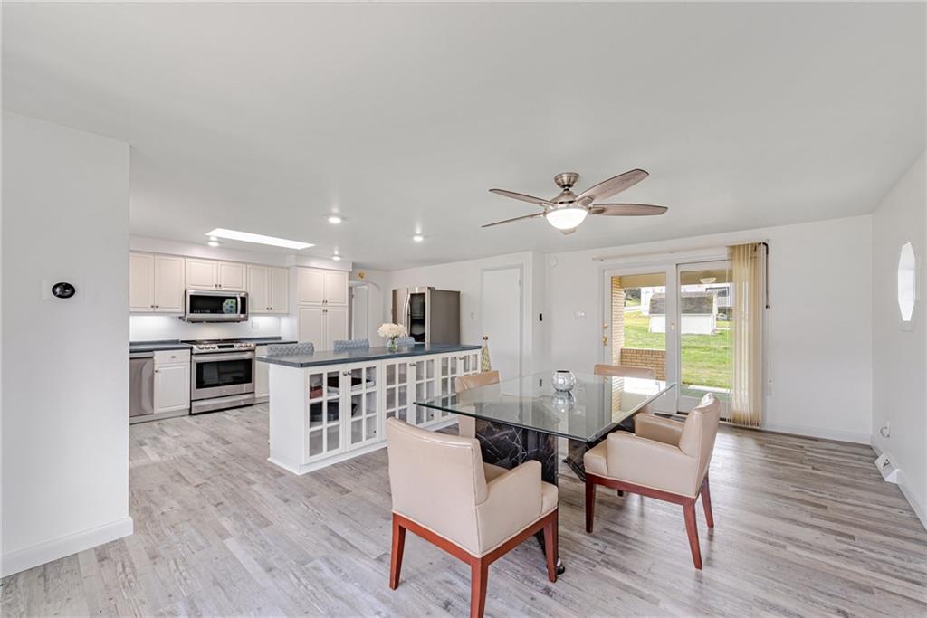 9746 McClellan Street North Huntingdon, PA 15642 - Photo 10 of 30 a living room with kitchen island furniture and a wooden floor