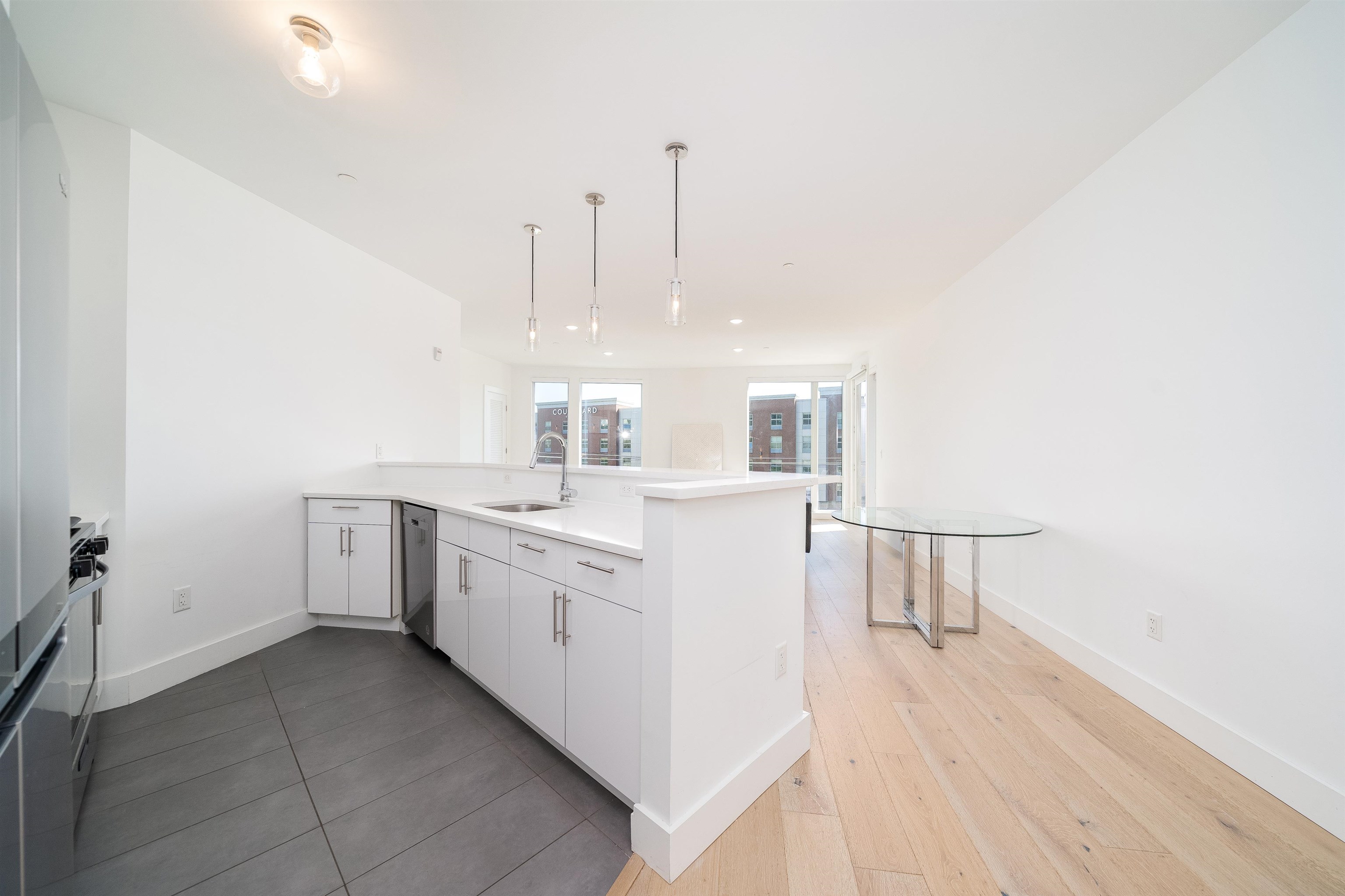8621 River Road, Unit 6A North Bergen, NJ 07047 - Photo 12 of 42 a large white kitchen with sink and dishwasher
