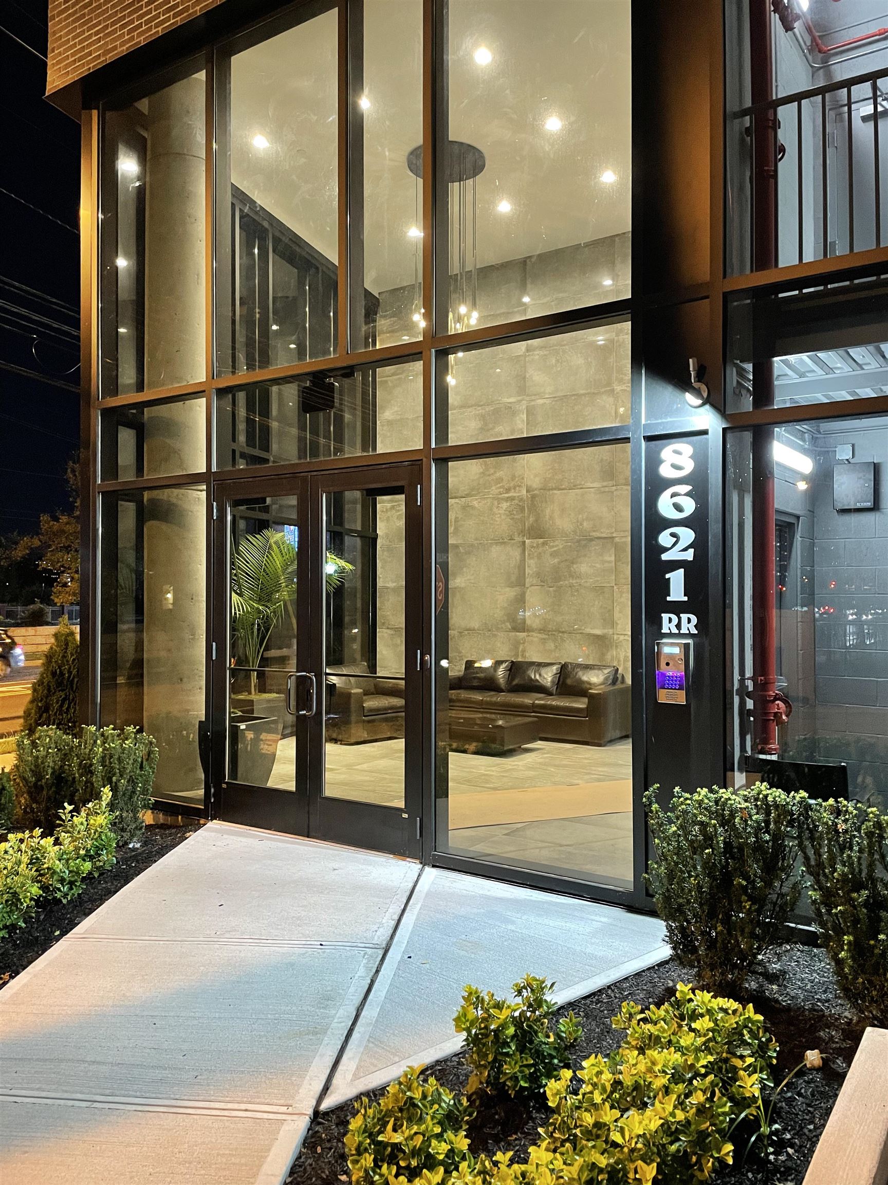 8621 River Road, Unit 6A North Bergen, NJ 07047 - Photo 38 of 42 a front view of a building with a glass door